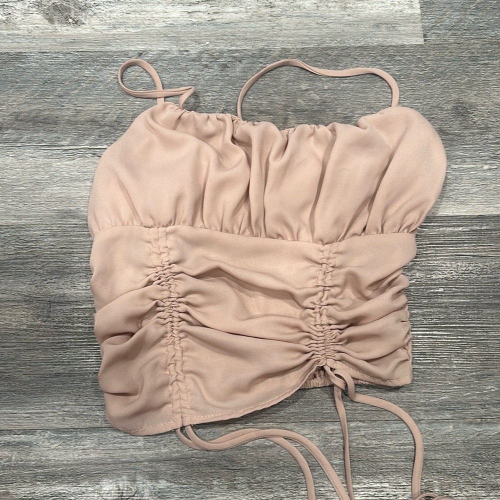 pink tank top cinched in the back ; dressy occasions